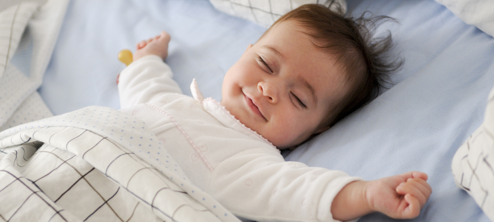 baby sleeping smiling