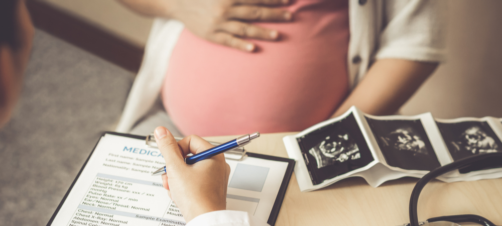 preg woman at doc office with med chart